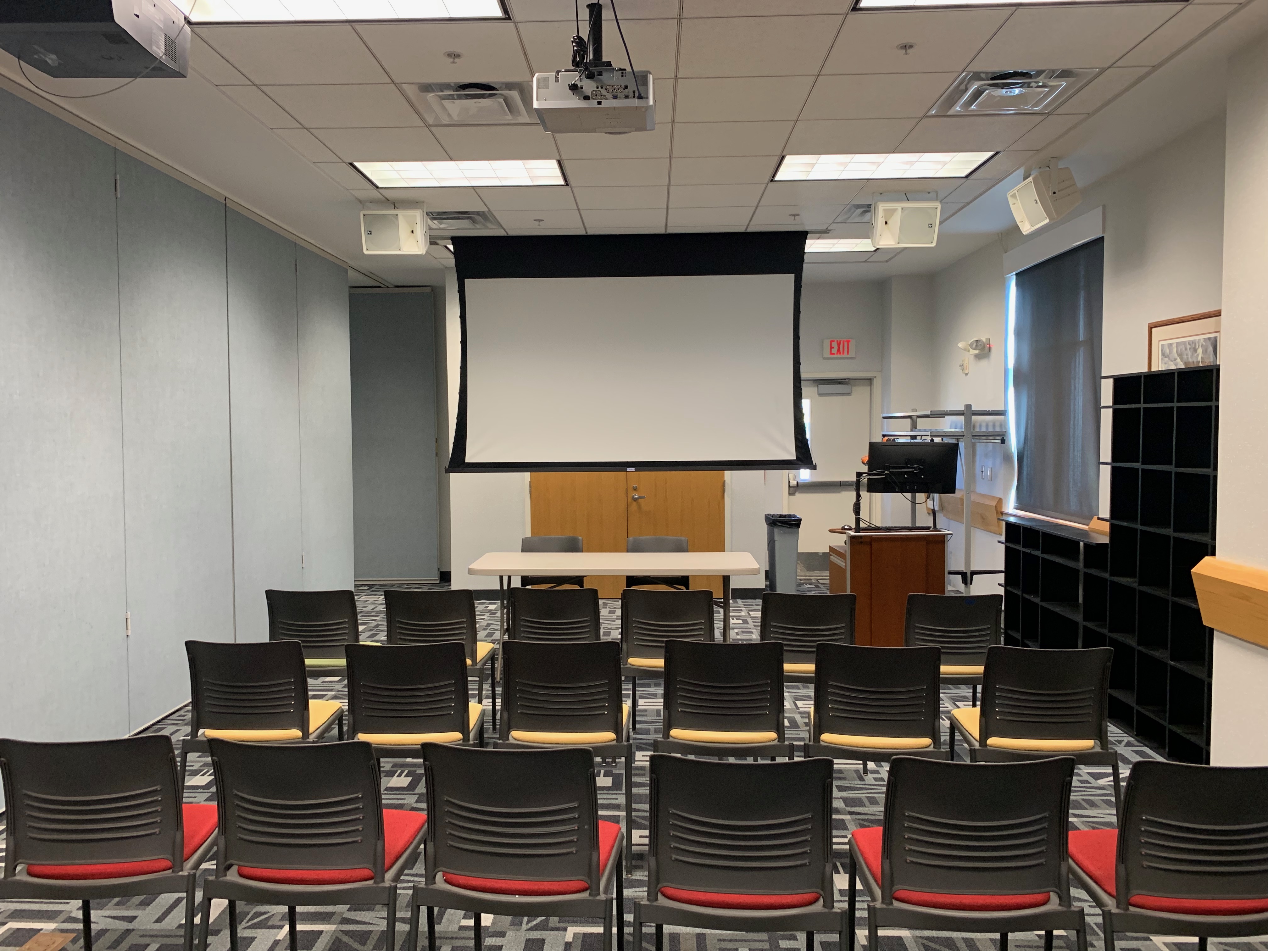 Room B with chairs in rows facing presenter or panel table at front of room; up to 30 people (plus presenter or panel table).