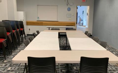 Meeting Room B with tables and chairs in boardroom configuration