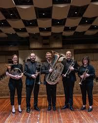 Black Willow Brass Quintet stand together with their instruments
