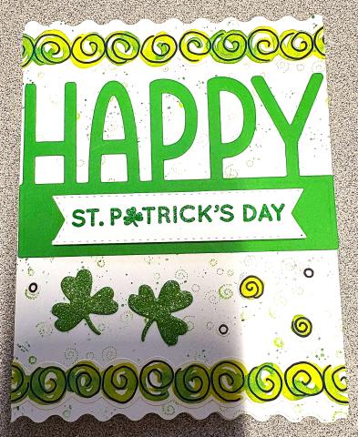 St. Patrick's Day greeting card with green swirls and clovers
