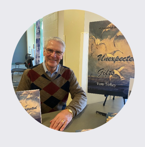 Author Tom Toftey poses with his book Unexpected Gifts