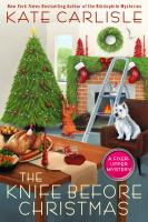 The Knife Before Christmas by Kate Carlisle, featuring a Christmas tree, holiday table, and dog and cat by a fireplace
