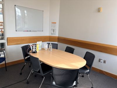 Our West Study Room offers an oval table with up to six chairs, a dry erase board, and power outlets.