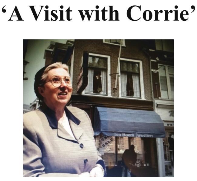 A Visit With Corrie: an older woman with glasses stands in front of a store