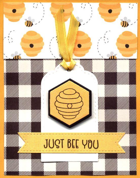 A greeting card with beehives,, bees, and buffalo plaid that reads Just Bee You