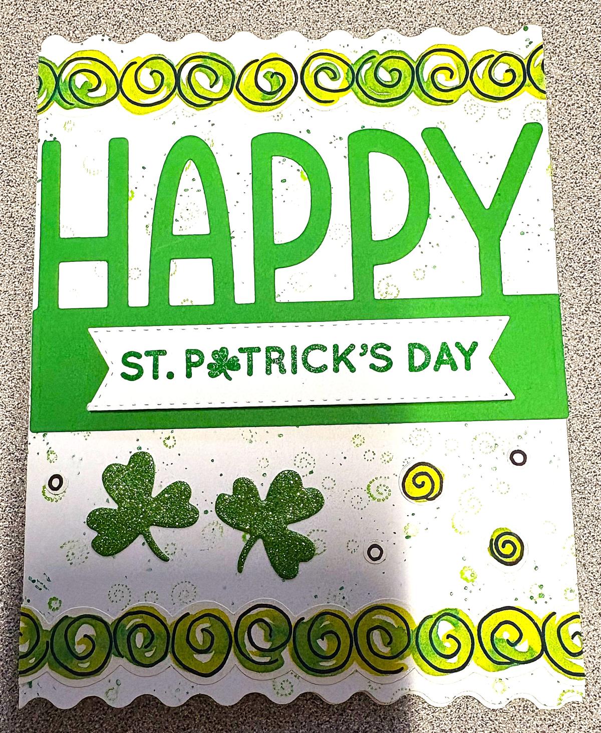 St. Patrick's Day greeting card with green swirls and clovers