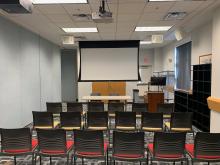 Room B with chairs in rows facing presenter or panel table at front of room; up to 30 people (plus presenter or panel table).